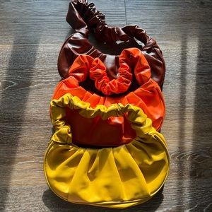 Yellow, orange , and brown Multipack of hand held or shoulder bags